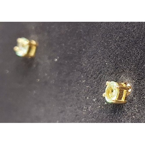 49 - A pair of hallmarked 18ct gold earrings set with tourmalines, gross weight 1.3g. UK shipping £14.