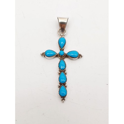 9 - A silver cross set with turquoise, length 1.75