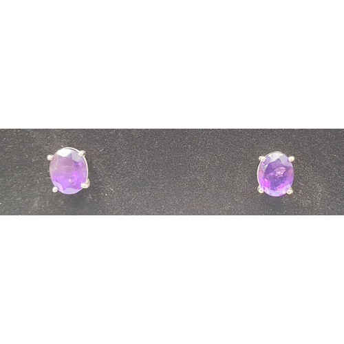 14 - A pair of silver earrings set with amethysts. UK shipping £14.