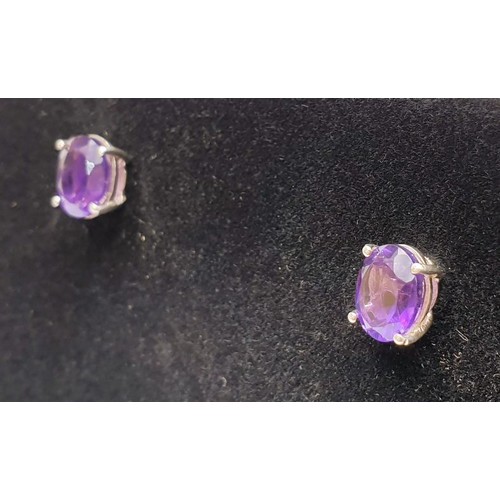 14 - A pair of silver earrings set with amethysts. UK shipping £14.