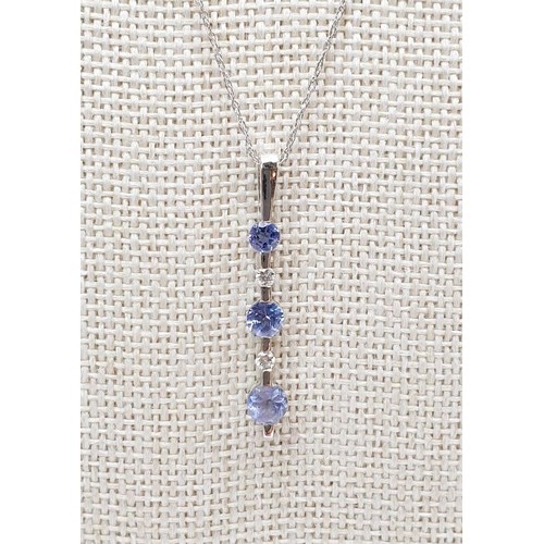 25 - A 9ct white gold pendant set with tanzanite and diamonds on a 10ct white gold chain, weight 1.5g. UK... 