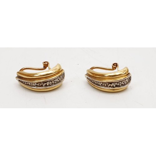 29 - A pair of 9ct gold clip on earrings, weight 5.1g. UK shipping £14.