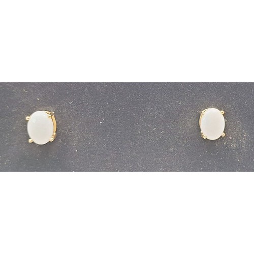 32 - A pair of 9ct gold earrings set with opals, gross weight 1.2g. UK shipping £14.