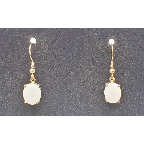 36 - A pair of 9ct gold drop earrings set with opals. gross weight 3.6g. UK shipping £14.