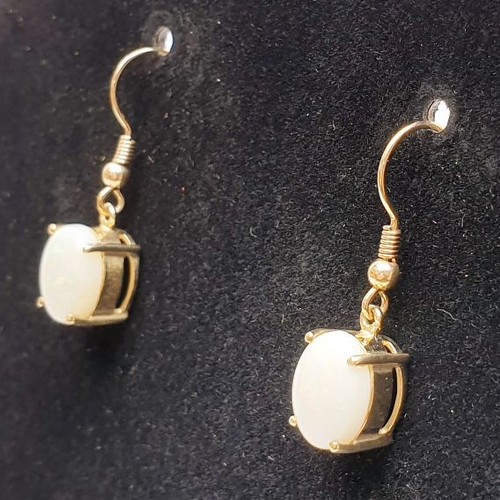 36 - A pair of 9ct gold drop earrings set with opals. gross weight 3.6g. UK shipping £14.