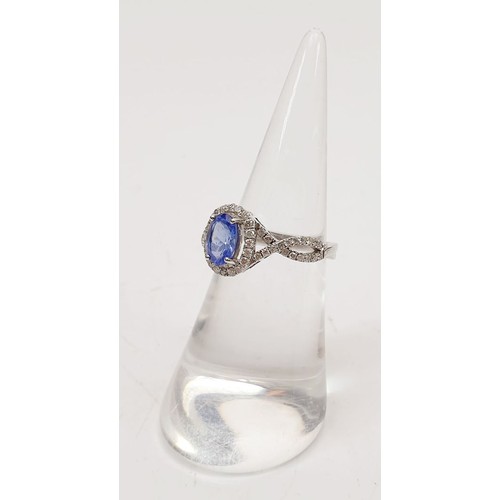 45 - A 14ct white gold ring by Sophia Fiori set with a tanzanite and diamonds, size J/K, weight 2.5g. UK ... 