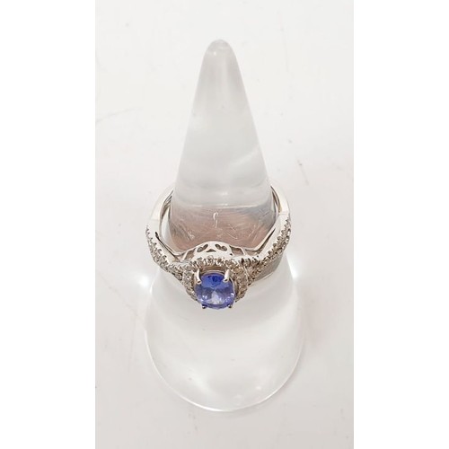 45 - A 14ct white gold ring by Sophia Fiori set with a tanzanite and diamonds, size J/K, weight 2.5g. UK ... 