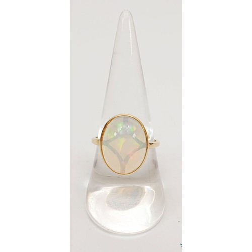 53 - A 9ct gold ring set with AA welo opal, size P/Q, gross weight 3g. UK shipping £14.