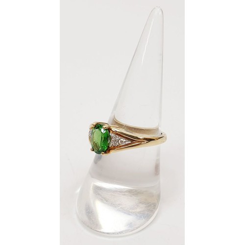 58 - A hallmarked 9ct gold ring set with tsavorite and diamonds, size N/O, gross weight 3.8g. UK shipping... 