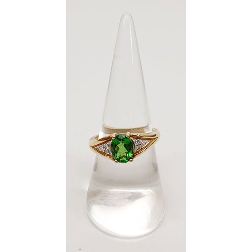 58 - A hallmarked 9ct gold ring set with tsavorite and diamonds, size N/O, gross weight 3.8g. UK shipping... 