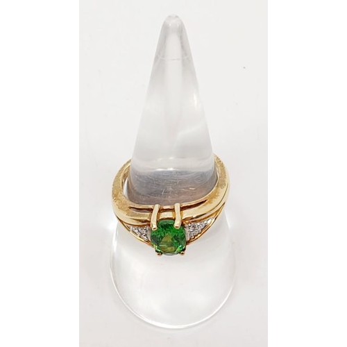 58 - A hallmarked 9ct gold ring set with tsavorite and diamonds, size N/O, gross weight 3.8g. UK shipping... 