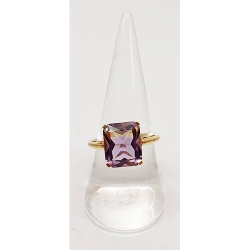 64 - A hallmarked 9ct gold ring set with ametrine, size Q, gross weight 3.2g. UK shipping £14.