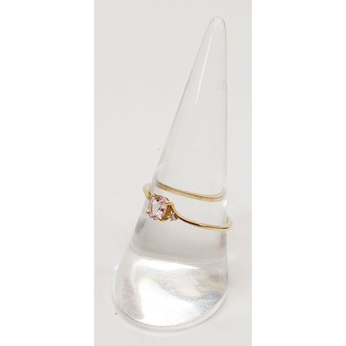 66 - A 9ct gold ring set with Pradesh spinel and diamonds, size Q, gross weight 0.9g. UK shipping £14.