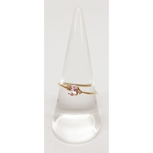 66 - A 9ct gold ring set with Pradesh spinel and diamonds, size Q, gross weight 0.9g. UK shipping £14.