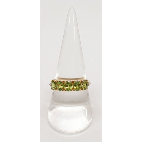 67 - A hallmarked 9ct gold ring set with demantoid garnet and diamonds, size Q, gross weight 2.3g. UK shi... 