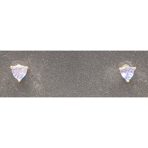 34 - A pair of 9ct gold earrings set with tanzanite, gross weight 0.9g. UK shipping £14.