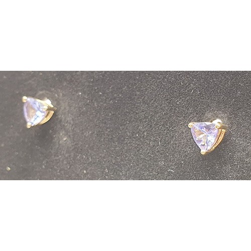 34 - A pair of 9ct gold earrings set with tanzanite, gross weight 0.9g. UK shipping £14.