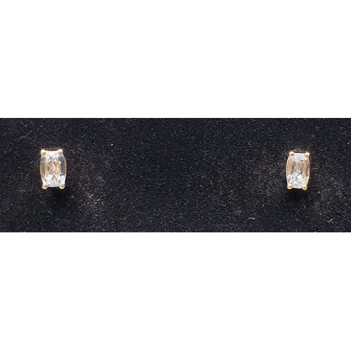 33 - A pair of 9ct gold earrings set with aquamarines, gross weight 1g. UK shipping £14.