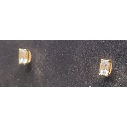 33 - A pair of 9ct gold earrings set with aquamarines, gross weight 1g. UK shipping £14.