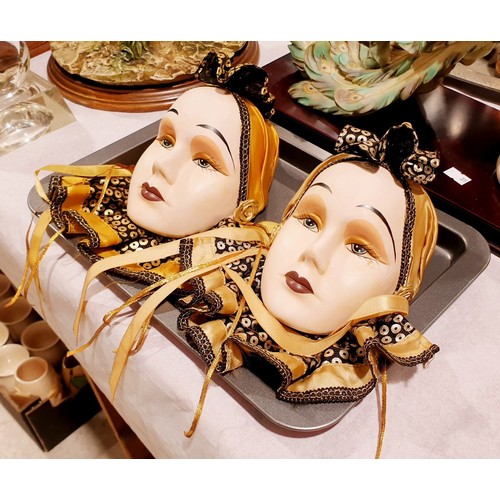 134 - A pair of ceramic wall masks, length 8