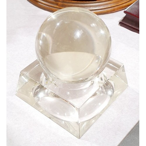 137 - A glass ball on a glass stand, height 4.5