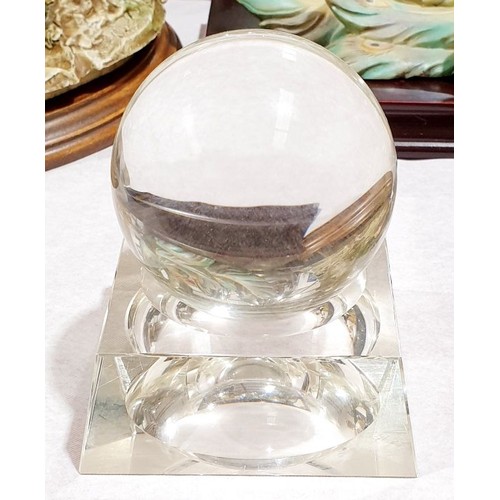 137 - A glass ball on a glass stand, height 4.5