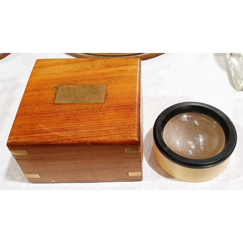 140 - A wooden box with a magnifier, with a brass plaque inscribed 