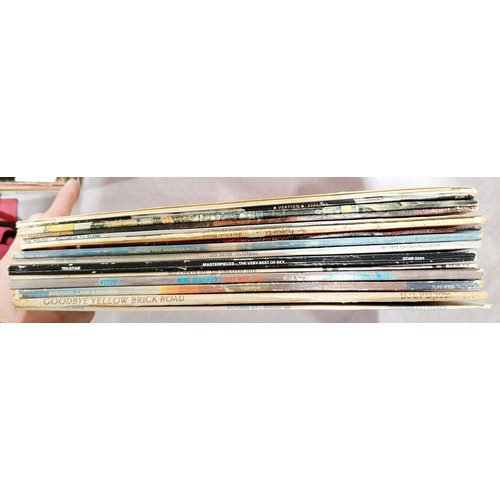 209 - A selection of LPs including Paul McCartney, The Beatles, and Elton John. UK shipping £14.