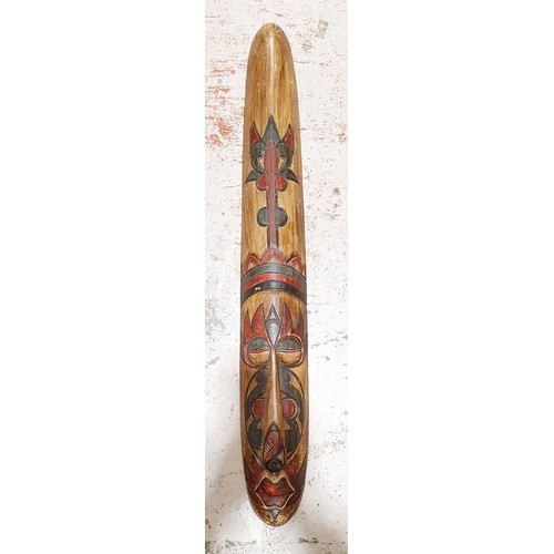 285 - A wooden tribal mask wall hanging, length 39.25