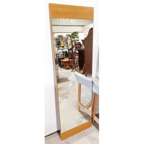 259 - An oak mirror, height 64.75