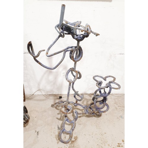 280 - A wrought iron sculpture of a fisherman, height 45.5