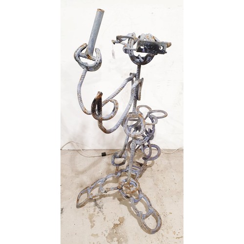 280 - A wrought iron sculpture of a fisherman, height 45.5