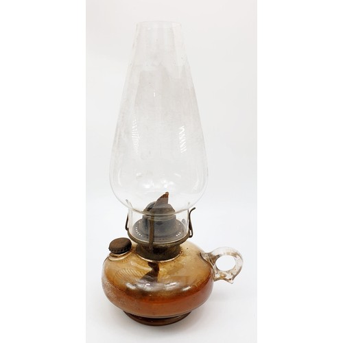 298 - An antique oil lamp, height 13.25