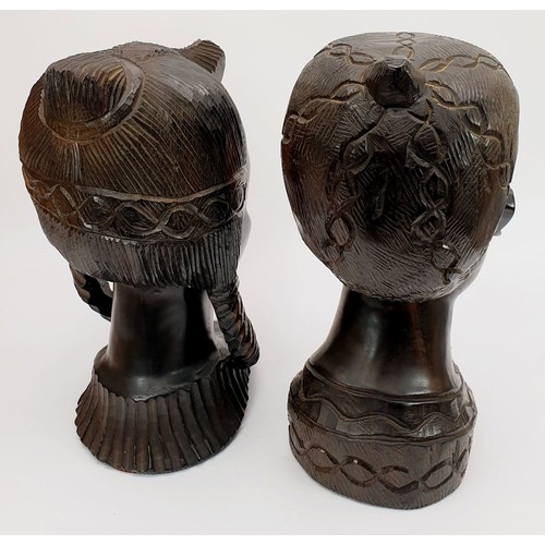 299 - A pair of carved lignum vitae busts of an African boy and girl, height 11.75