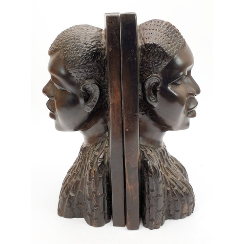 302 - A pair of Lignum vitae bookends carved as an African man and woman, height 9.5