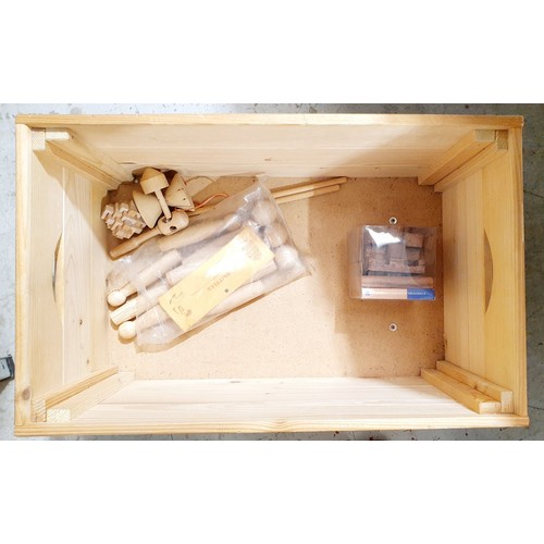 398 - A wooden toy box and contents, width 21.75