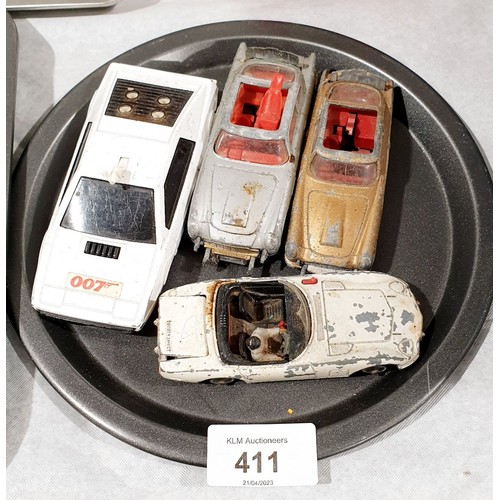 411 - Four Corgi James Bond vehicles. UK shipping £14.