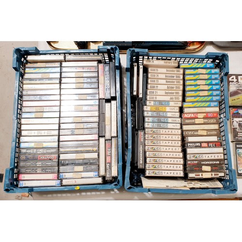 438 - Two boxes of Spectrum games and tapes. No shipping. Arrange collection or your own packer and shippe... 