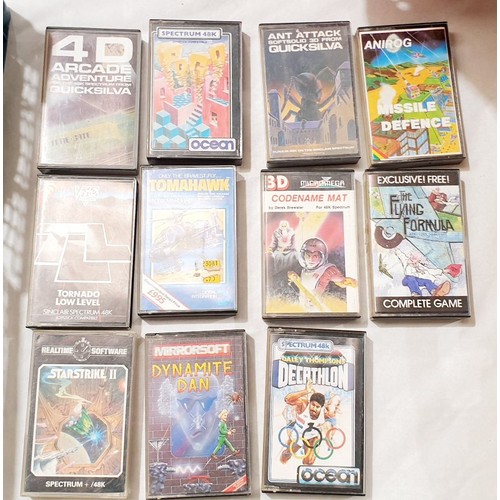 438 - Two boxes of Spectrum games and tapes. No shipping. Arrange collection or your own packer and shippe... 