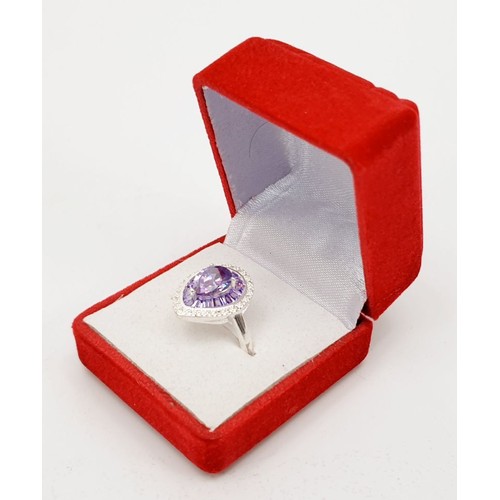 5 - A 925 silver ring set with purple and white stones, size P. UK shipping £14.