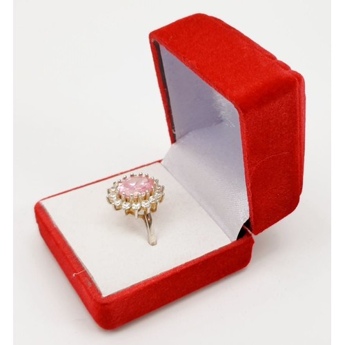 7 - A 925 silver ring set with pink and white stones, size O. UK shipping £14.