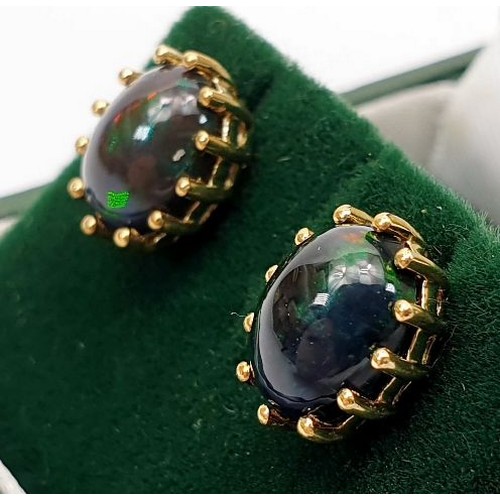 10 - A pair of 9ct gold earrings set with midnight opals, gross weight 2.4g. UK shipping £14.