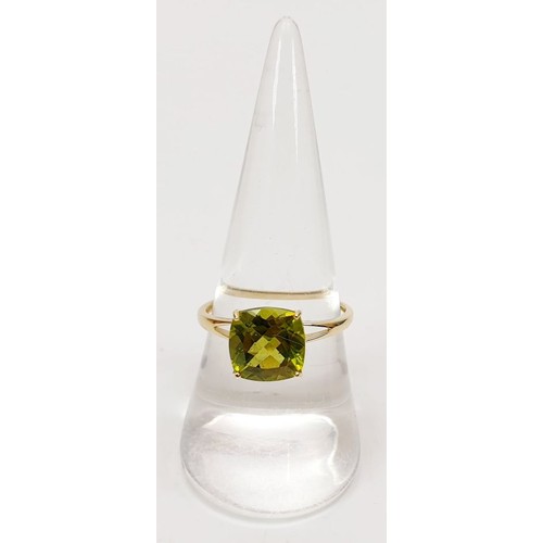 30 - A hallmarked 9ct gold peridot solitaire ring, size Q, gross weight 1.8g. UK shipping £14.