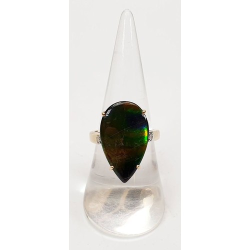 31 - A hallmarked 9ct gold ring set with ammolite and diamond, size O, gross weight 5.1g. UK shipping £14... 