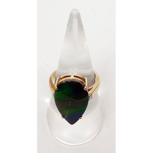 31 - A hallmarked 9ct gold ring set with ammolite and diamond, size O, gross weight 5.1g. UK shipping £14... 