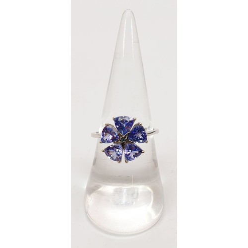 32 - A hallmarked 9ct AA tanzanite cluster ring, size O, gross weight 2.2g. UK shipping £14.