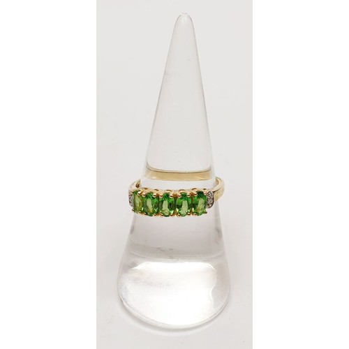 40 - A hallmarked 9ct gold tsavorite half eternity ring, size N, gross weight 2.6g. UK shipping £14.