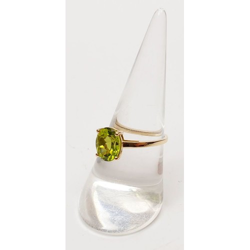 45 - A hallmarked 9ct gold peridot solitaire ring, size O, gross weight 1.8g. UK shipping £14.