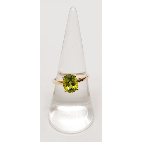 45 - A hallmarked 9ct gold peridot solitaire ring, size O, gross weight 1.8g. UK shipping £14.