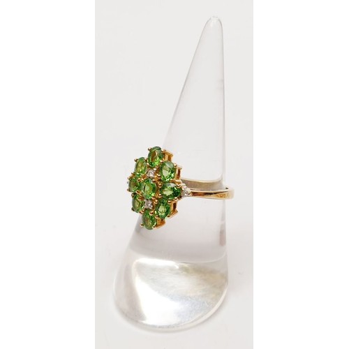 48 - A hallmarked 9ct gold tsavorite and diamond cluster ring, size N/O, gross weight 4.2g. UK shipping £... 